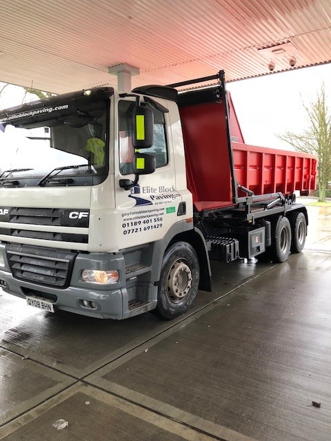 The Elite Block Paving DAF tipper lorry, signwritten with the company name, website and phone numbers